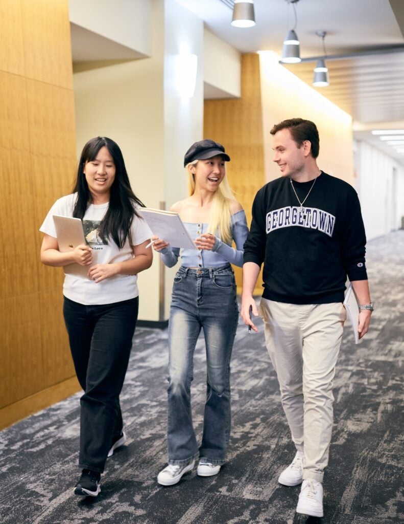 Students talking while walking to class